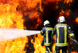 Firefighters extinguish a fire. Firefighters extinguish a fire.