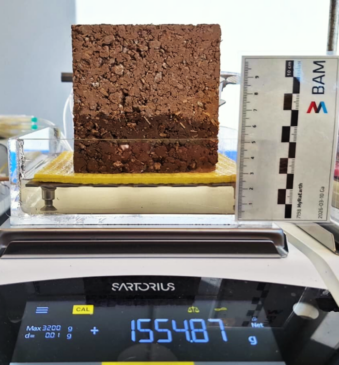 A clay brick on a scale